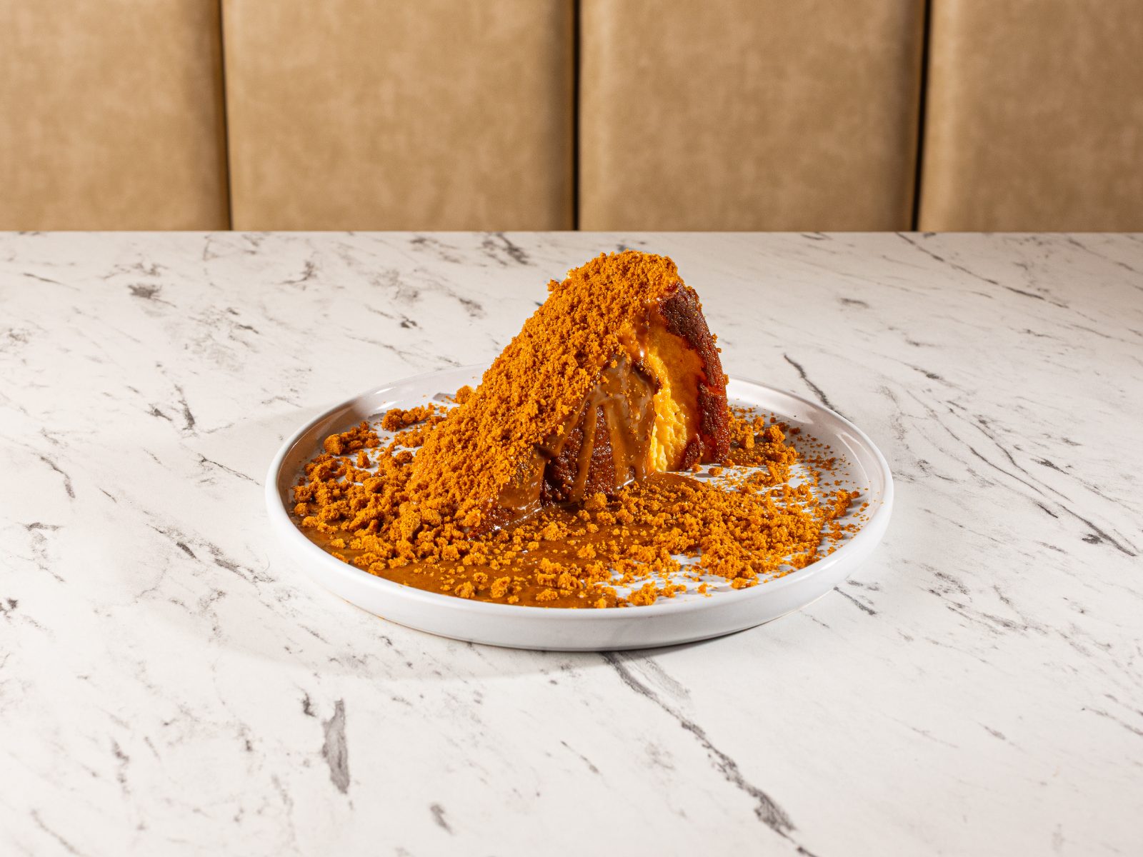 Biscoff cheesecake under a mountain of caramelised crumb
