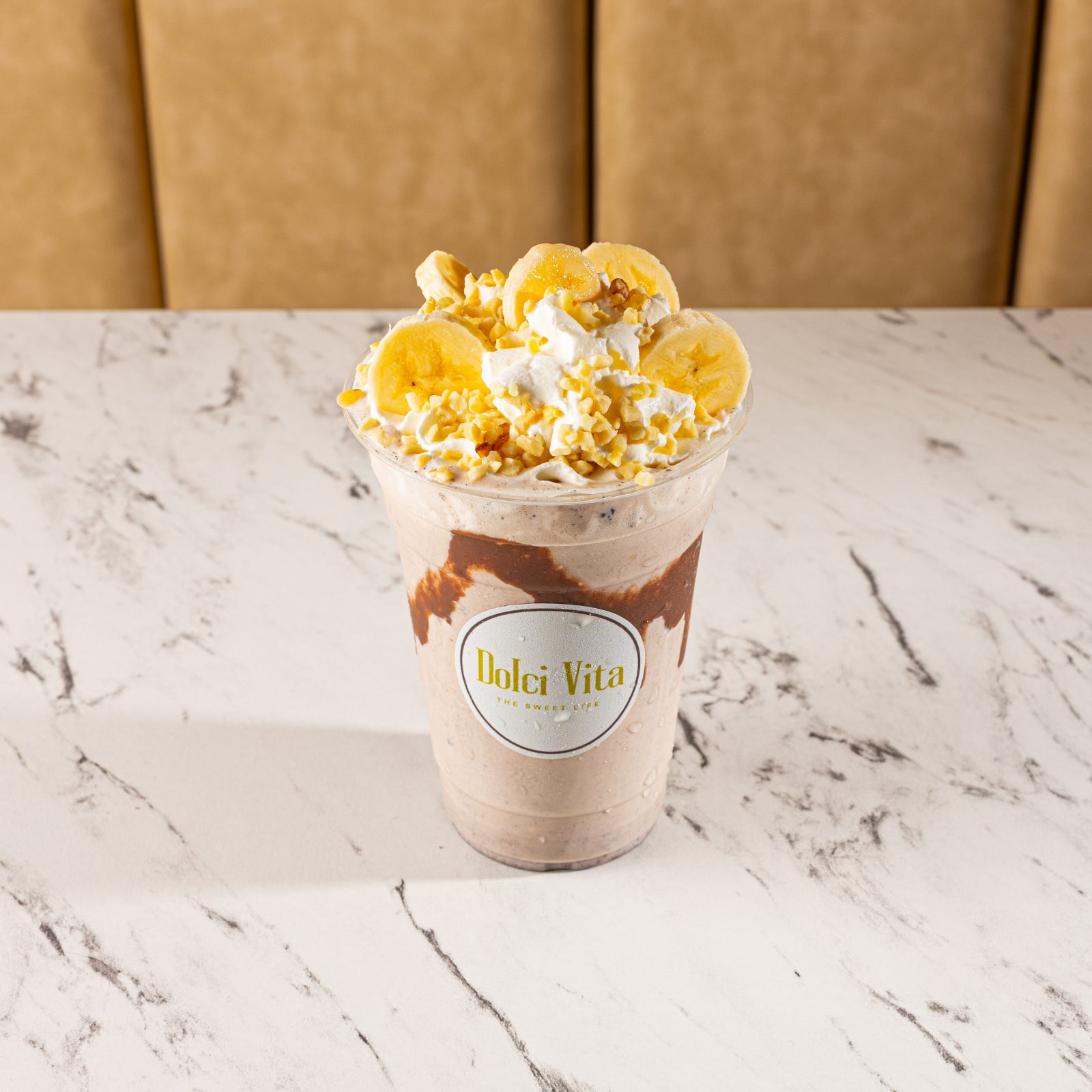 Banoffee milkshake topped with banana and nuts